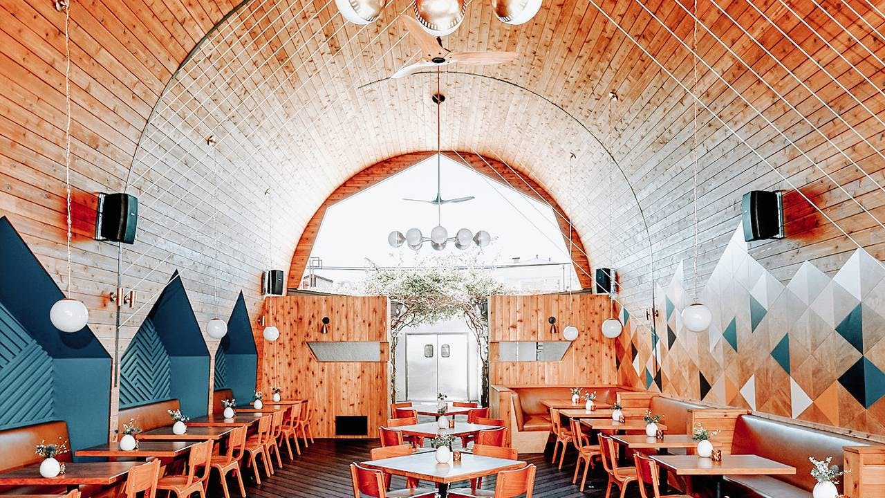 Stylish venue with arched ceiling, perfect for creative events and gatherings in Madison.