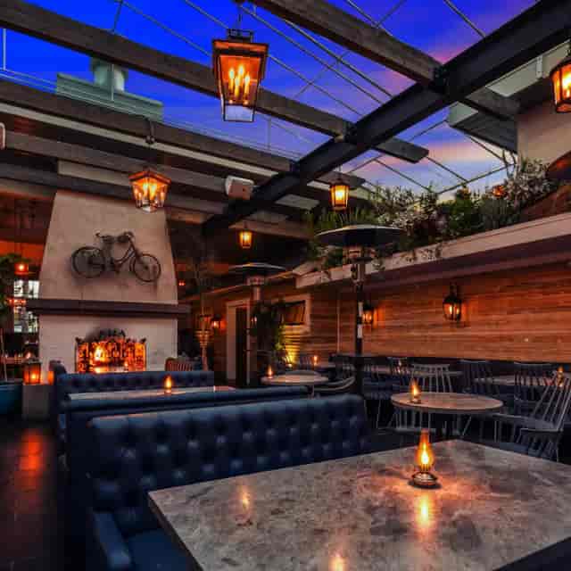 Stylish kitchen venue with warm lighting, perfect for cocktail receptions and networking events.
