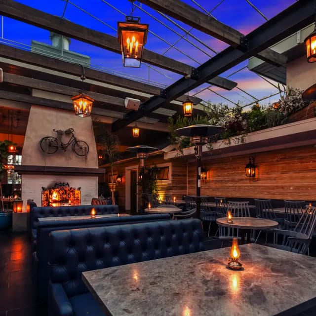 Stylish kitchen venue with warm lighting, perfect for cocktail receptions and networking events.