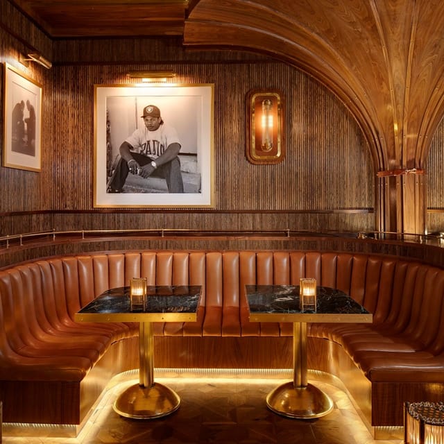 Rooftop patio with wooden paneling, ideal for upscale meetings and private events.