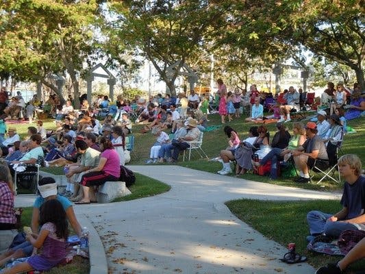 Arbor View Room outdoor gathering with shaded seating for community events in La Mesa.