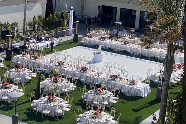 Outdoor event space at Town and Country Resort with floral centerpieces, perfect for weddings.