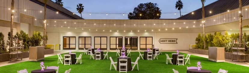 Outdoor event space at Town and Country Resort with elegant tables for meetings and gatherings.