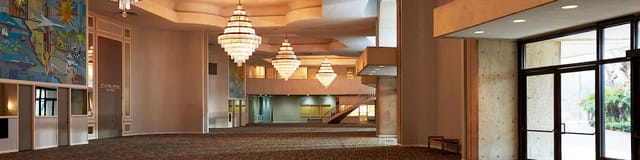 Spacious Town and Country Ballroom with elegant chandeliers for conferences and galas.