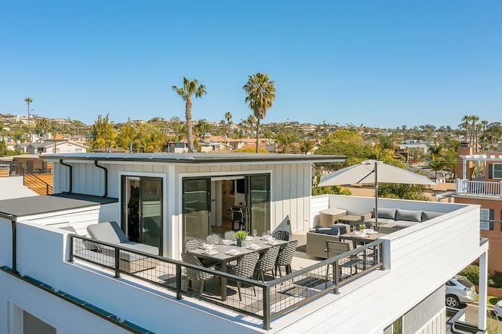Rooftop deck venue with stylish furniture for upscale events and gatherings.