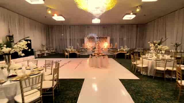 Elegant Babylon Palace Banquet Hall with chandelier, perfect for weddings and events.