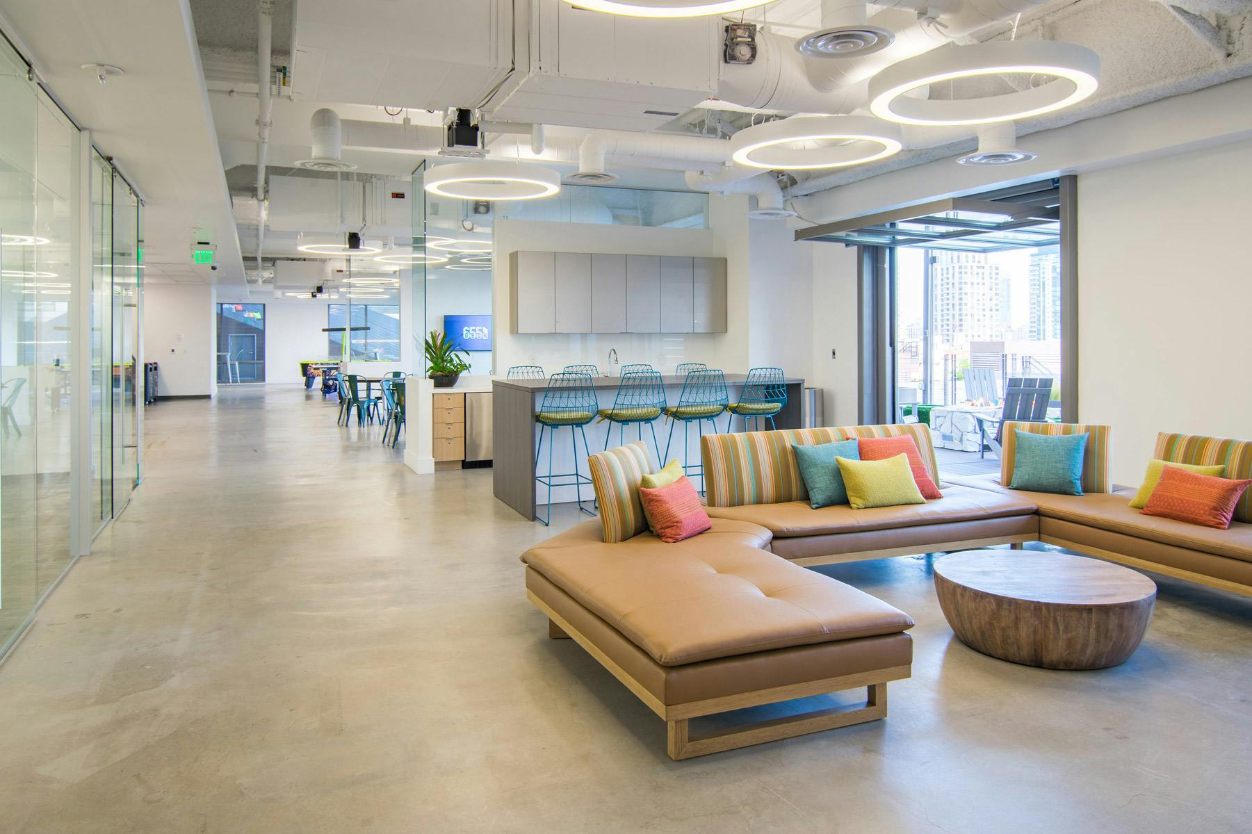 Modern open-concept workspace with vibrant lounge for events and networking at Deck655.