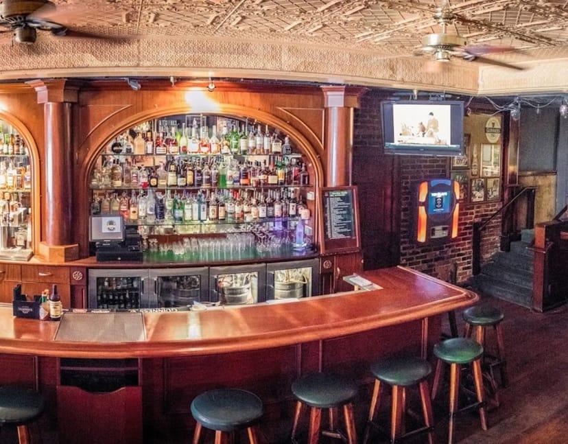 Inviting wooden bar at Patrick's Gaslamp Pub, ideal for networking and casual gatherings.