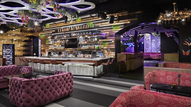 Stylish modern venue with vibrant bar for upscale cocktail receptions and private parties.