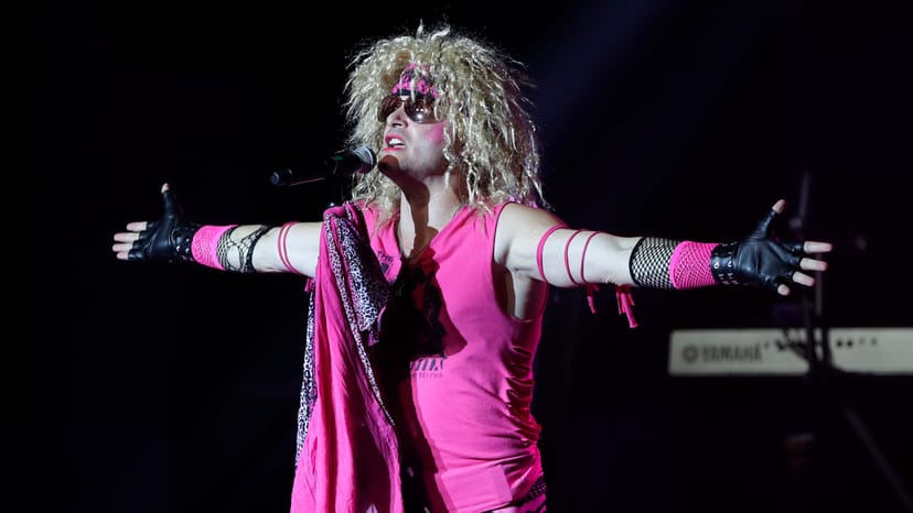 Vibrant performer in colorful outfit at Sweet Something Decor event entertainment.