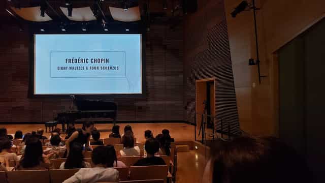 Westerbeck Recital Hall with grand piano, set for Chopin concert and lectures.