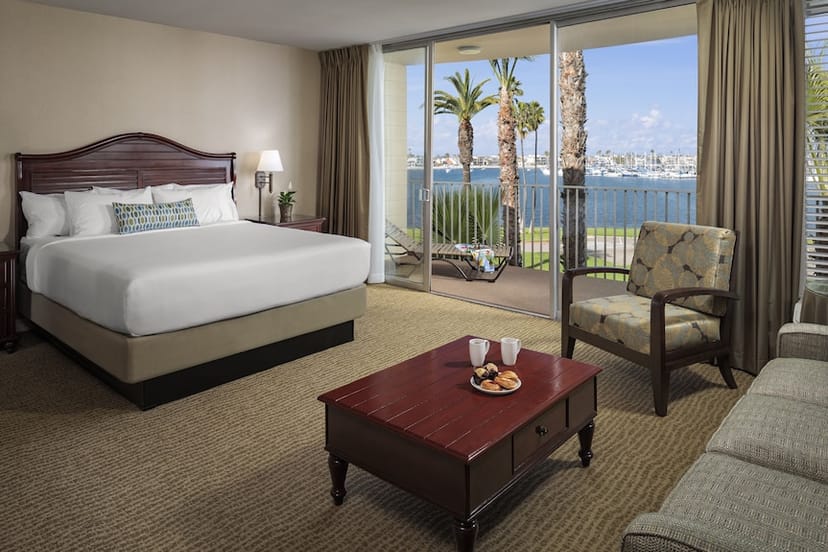 Deluxe Bayfront hotel room with king bed, ideal for retreats and meetings by the water.
