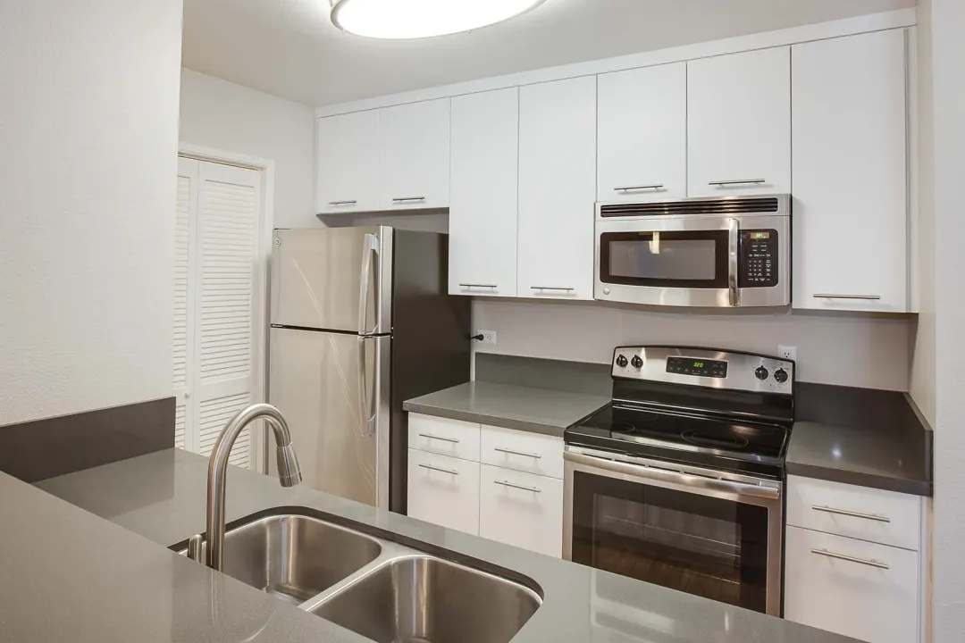 Modern kitchen with stainless steel appliances in Villa Parke Community Center for events.