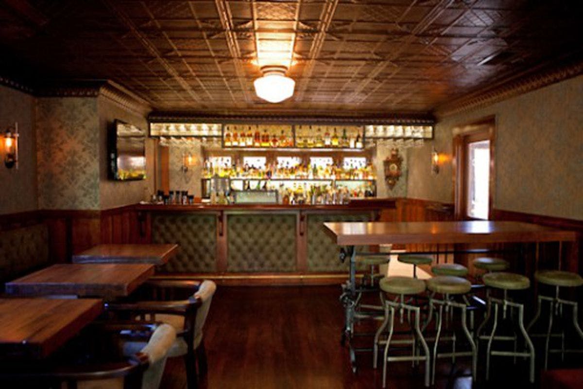 Sophisticated 1886 Bar with warm wood tones, perfect for networking events and gatherings.