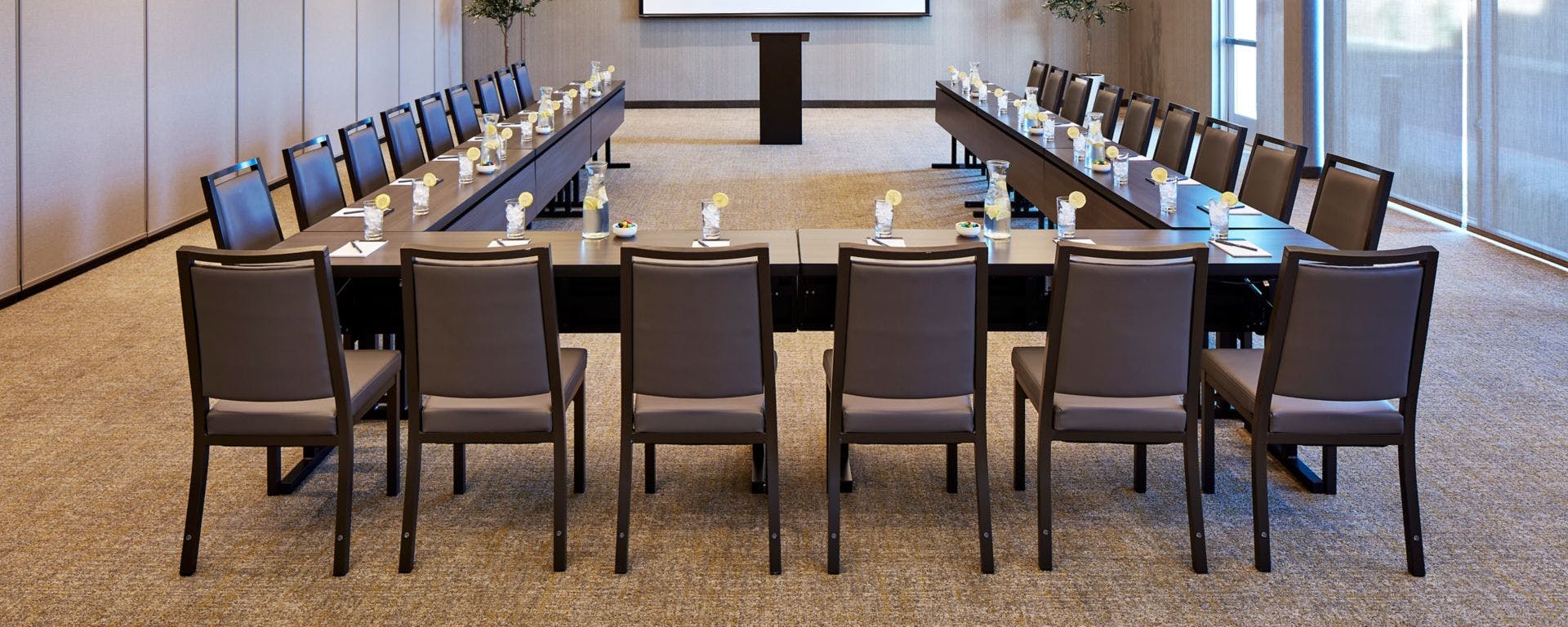 U-shaped conference room with natural light for productive business meetings.