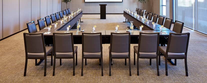 U-shaped conference room with natural light for productive business meetings.
