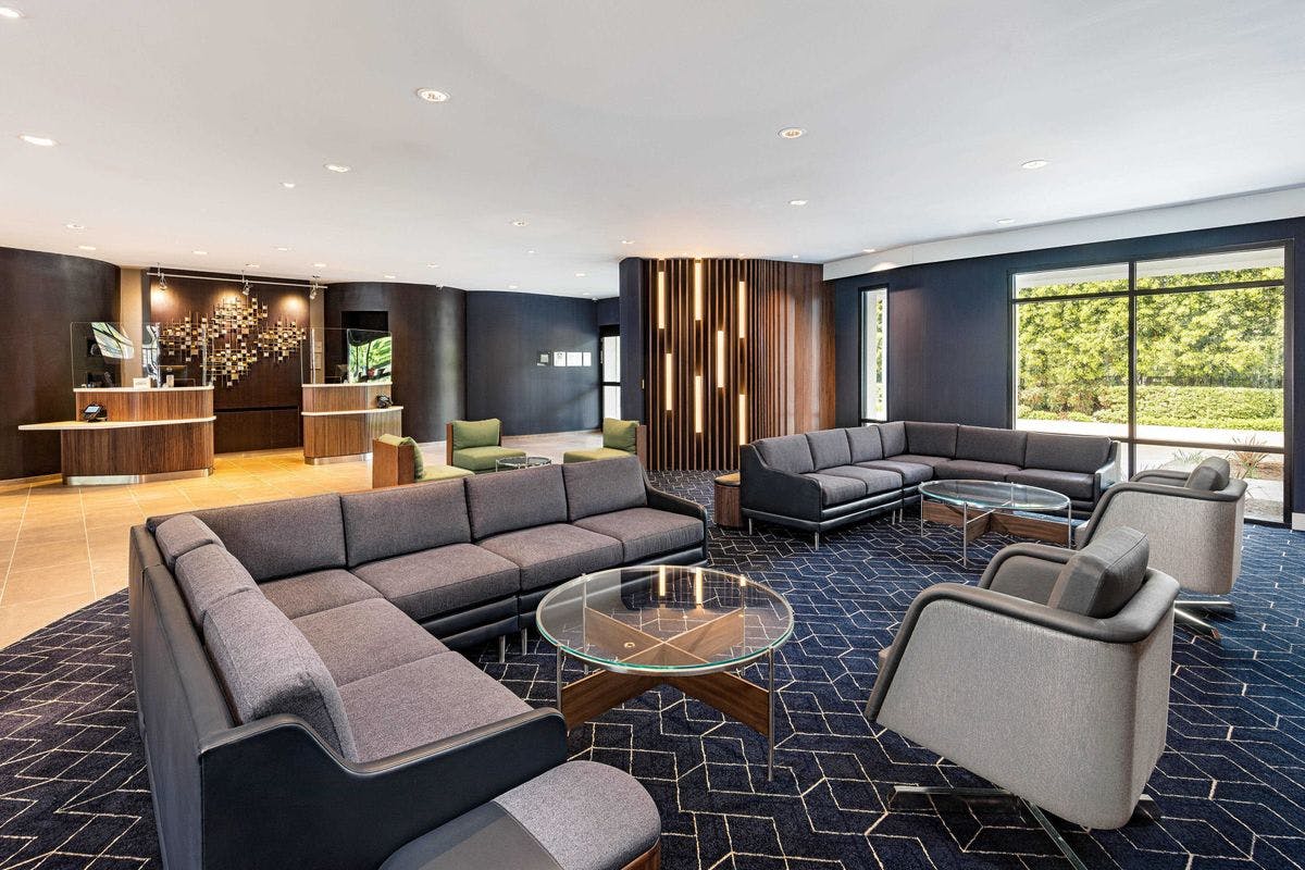 Modern lounge area in The Courtyard Business Center for networking and meetings.