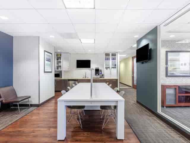 Modern meeting room with sleek table, ideal for collaborative events and brainstorming sessions.