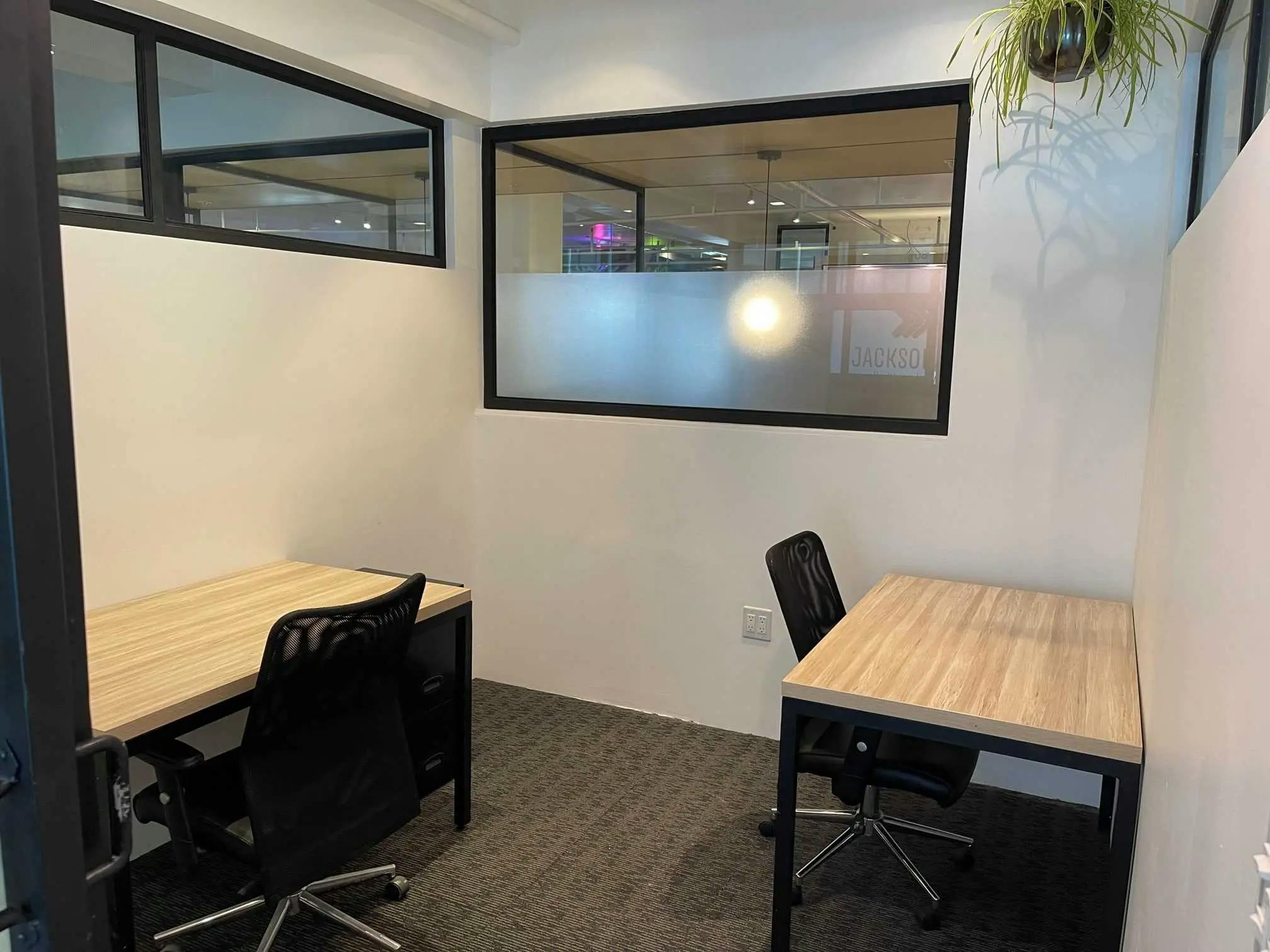Minimalist meeting space in Los Angeles with ergonomic chairs for collaborative sessions.