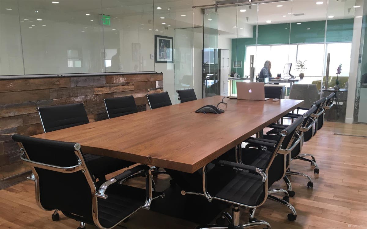 Modern conference room with wooden table for productive meetings and collaboration.
