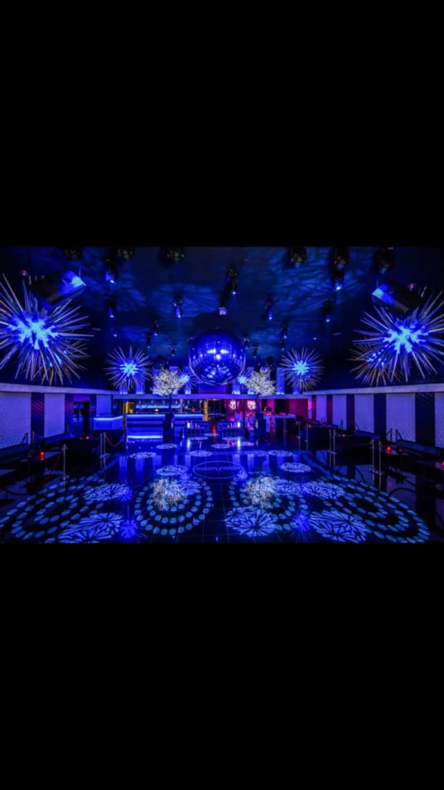 Vibrant dance floor with dramatic lighting at CLUB db LOUNGE for upscale events.