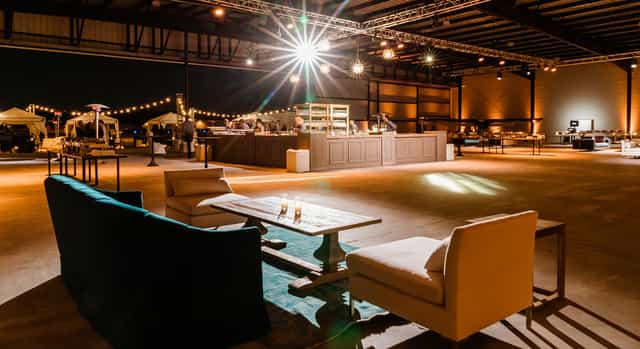 Spacious Hangar 21 South venue with lounge seating for stylish gatherings and events.