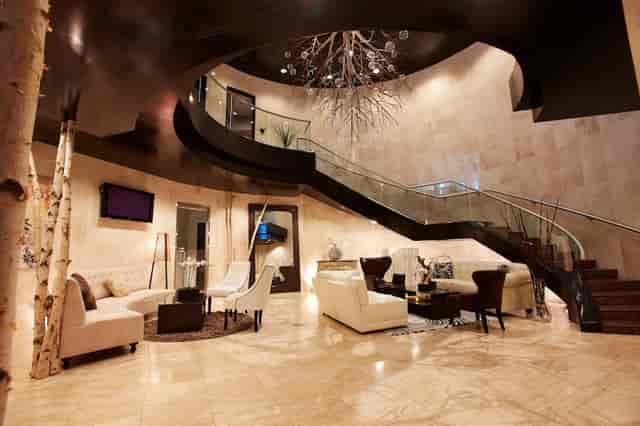 Elegant River Bar lobby with grand staircase, ideal for corporate events and networking.