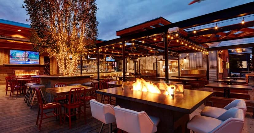 Outdoor patio at The Wine Pub, featuring string lights for events and gatherings.