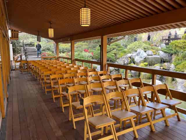 Bridal Suite in Japanese Friendship Garden with wooden chairs for serene outdoor events.