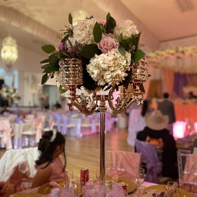 Elegant Small Ballroom with floral centerpiece, perfect for weddings and formal events.