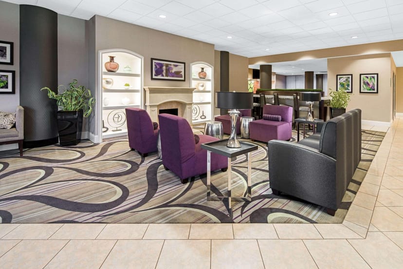 Modern lounge at La Quinta Inn, perfect for networking and casual meetings.