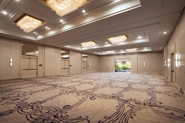 Elegant ballroom with chandeliers, perfect for corporate events and banquets.