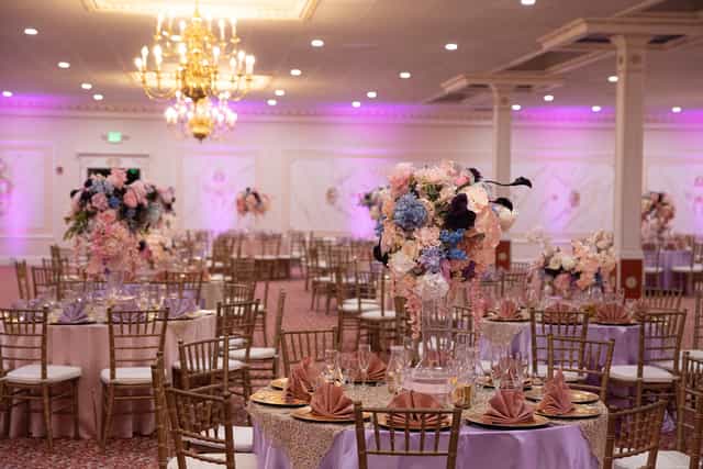 Elegant Rose Gardens foyer with floral centerpieces, ideal for weddings and upscale events.