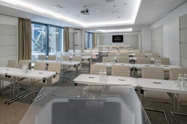 Budapest Meeting Room with modern tables, ideal for professional events and workshops.