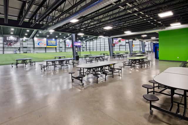 TBK Rehearsal Room 318: versatile event space with bright green wall for meetings and sports.