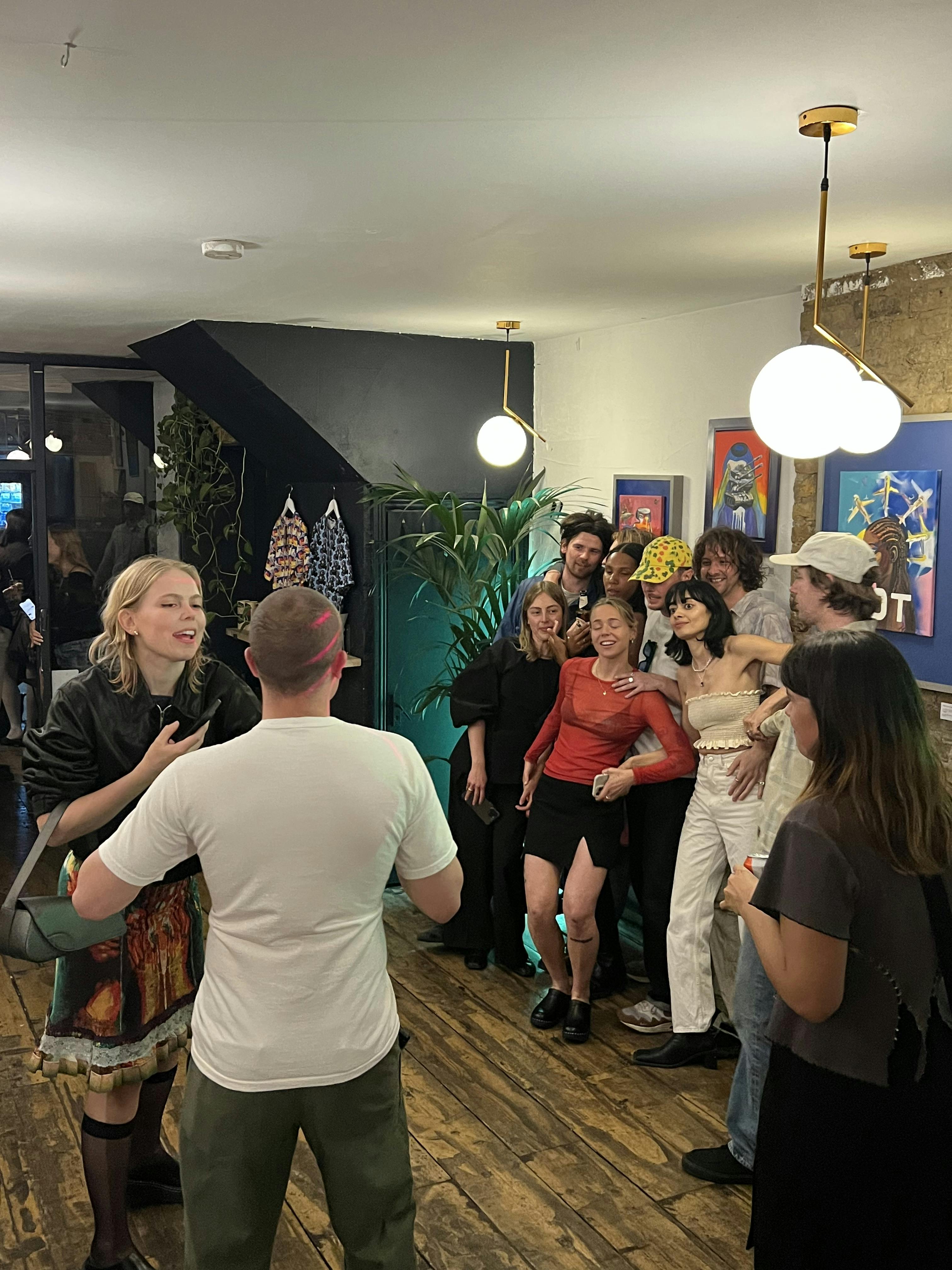 Vibrant networking event at Mosaic Clapton Wine Bar with diverse attendees and modern decor.