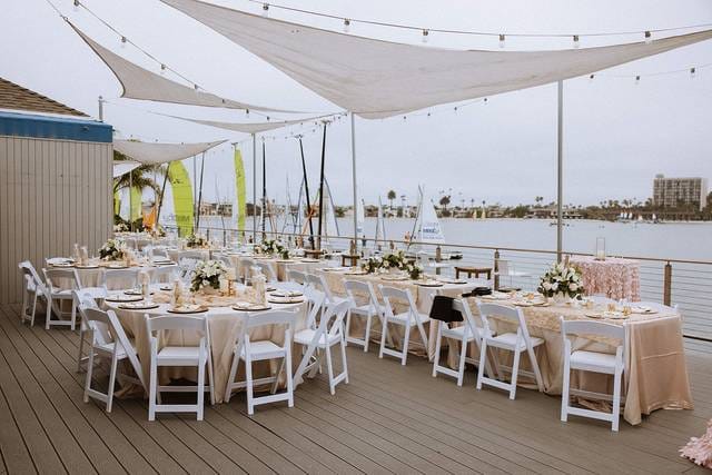 Tower Beach Club outdoor wedding venue with elegant tables and scenic waterfront backdrop.