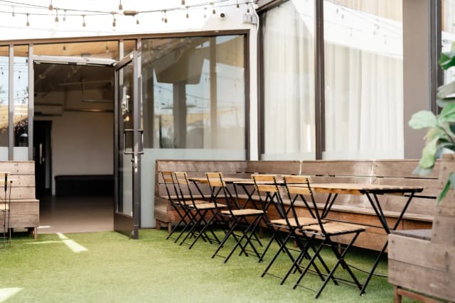 Versatile outdoor event space at Snake Oil Cocktail Co. for meetings and gatherings.