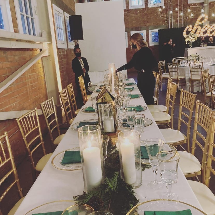 Elegant banquet table with gold chiavari chairs for formal dinner events.