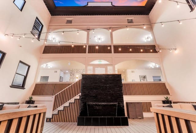 Elegant hotel suite with high ceilings, perfect for meetings and events.