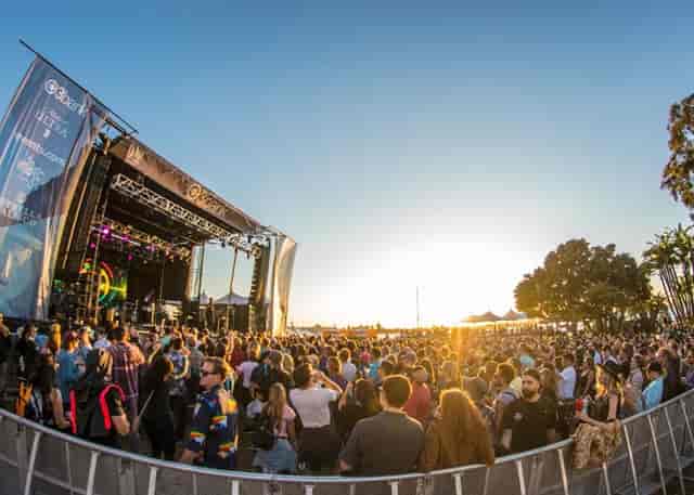 Main stage at San Diego Creative Events during a vibrant sunset concert.