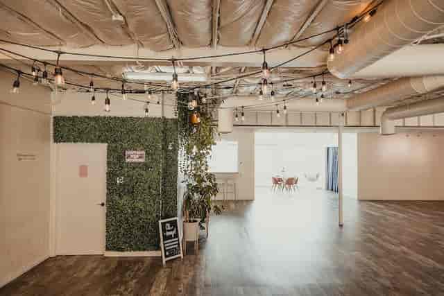 Modern event space in San Diego with greenery, ideal for networking and workshops.