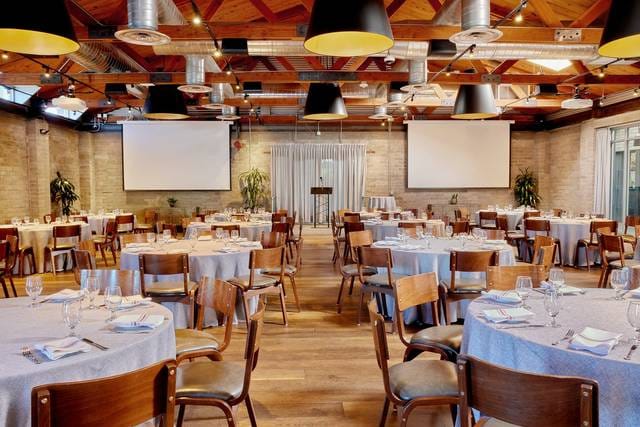 Showcase Room at Culinary Dropout with elegant dining setup for corporate events.