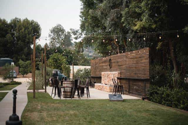 Charming outdoor event space with rustic decor, ideal for gatherings and receptions.