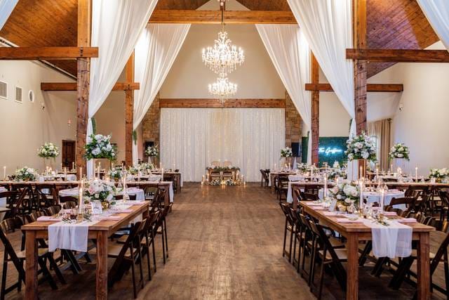 Elegant wedding venue with chandeliers and floral centerpieces at Harmony Estate.