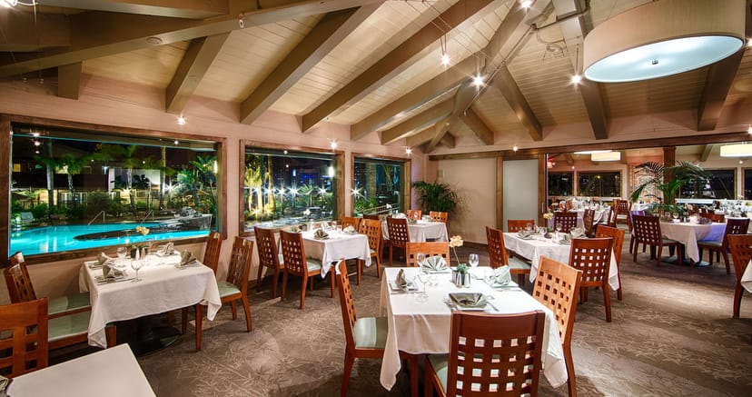 Blue Wave Bar & Grill dining space with elegant settings for corporate events and gatherings.