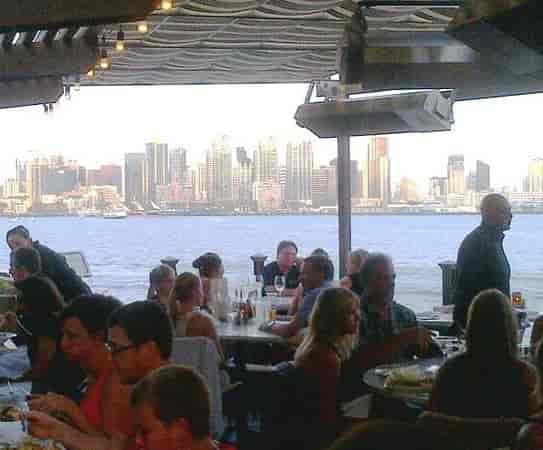 C Level Lounge waterfront dining with city skyline, perfect for events and networking.