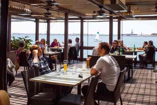 Vibrant waterfront patio at C Level Lounge for casual meetings and networking events.