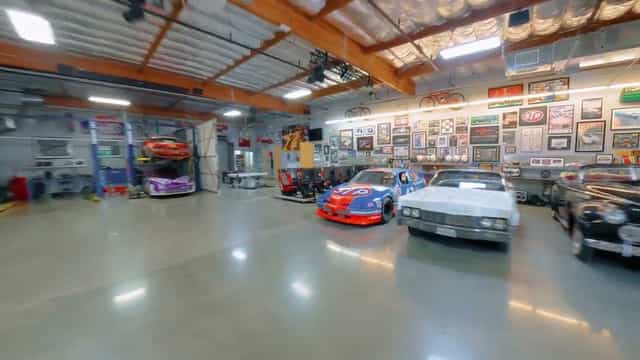 Vintage car-themed event space in Suite 101, ideal for corporate gatherings and networking.