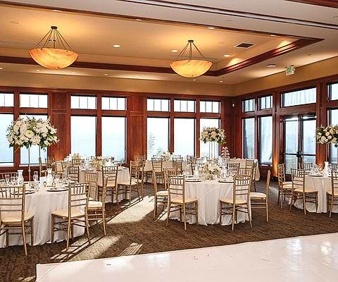 Large Main Ballroom in San Jose Clubhouse with elegant round tables for weddings and events.